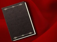 Libro in pelle adagiato su un panno rosso. Un modello di LibreOffice Writer per libri, ricco di opzioni e facilmente personalizzabile