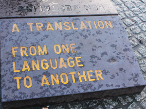 Iscrizione su pietra: "From one language to another"